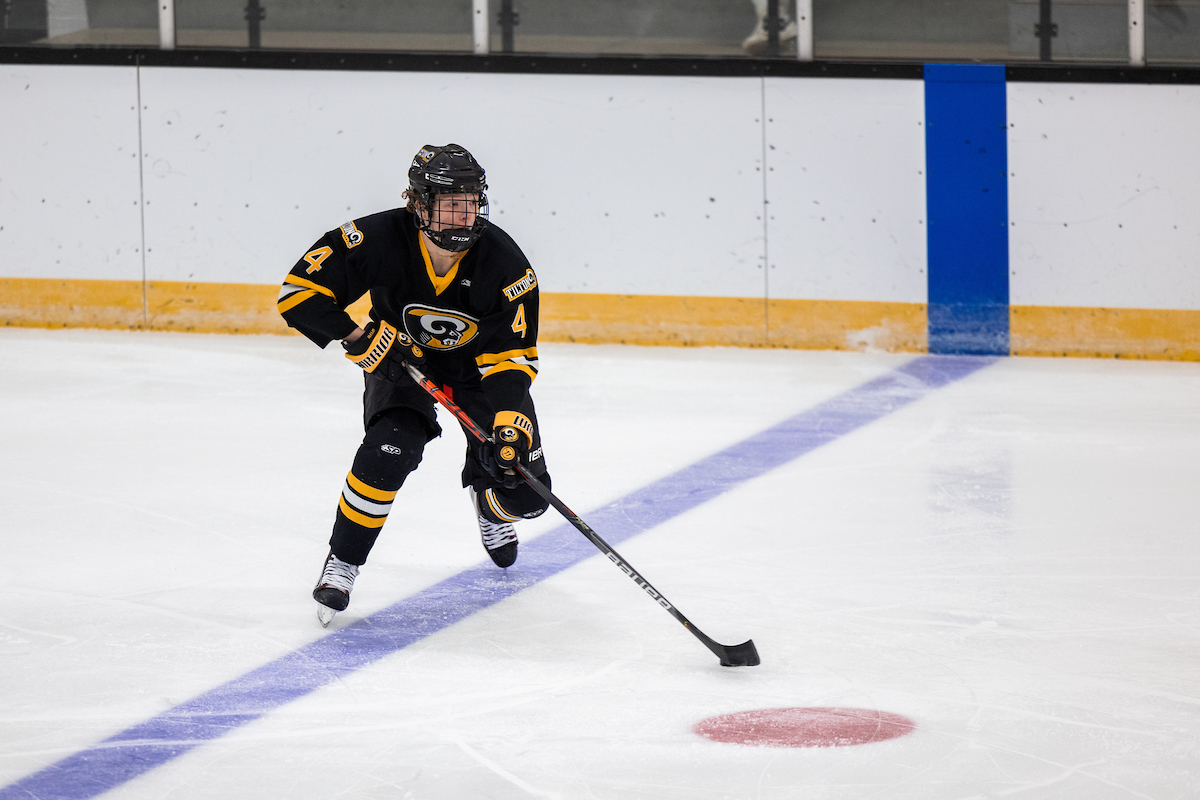 A Tilton boys hockey player skates up ice.