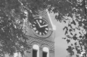 Black and white image of Knowles Hall clock tower at Tilton School