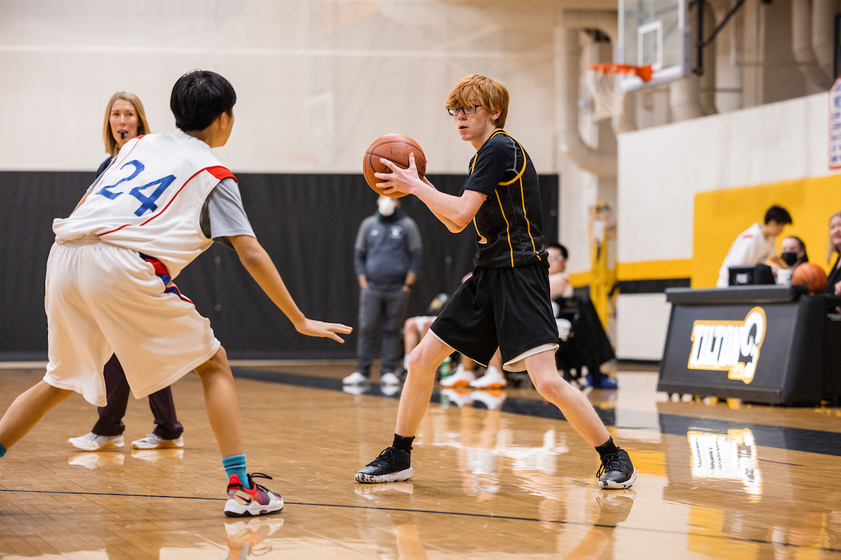 A Tilton boys junior varsity basketball player moves the ball on the perimeter during a game last season.